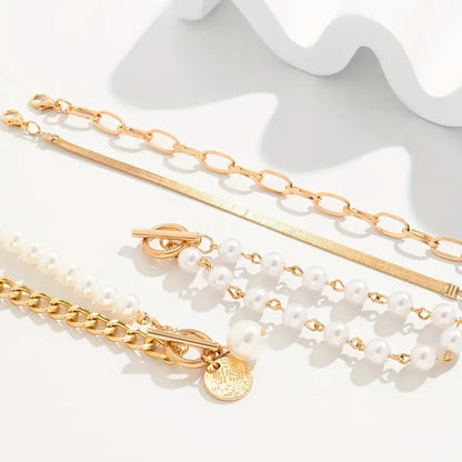 Chic 4-Piece Gold Bracelet Set – Snake, Pearls, and Links