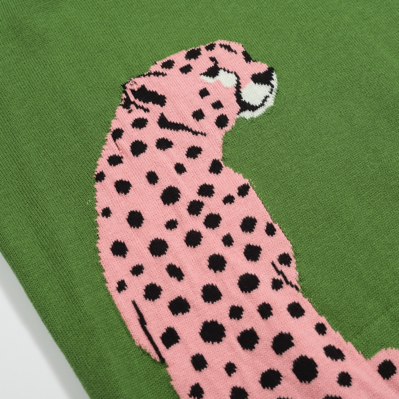 Retro Knit Jumper for Men – Vintage Green Jumper with Graphic Pink Cheetah Sleeves