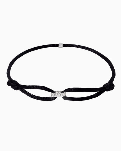 CORD BRACELET WITH CUBAN RING.